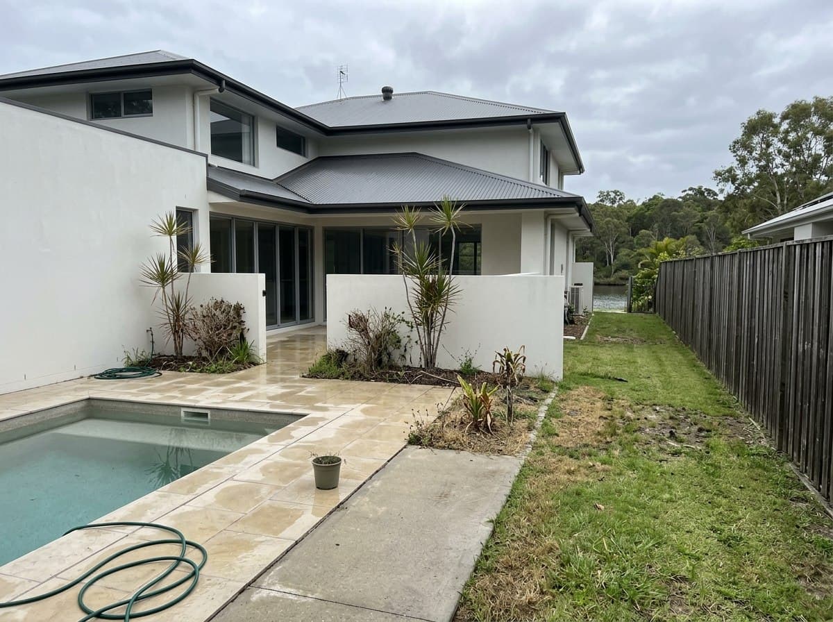 Dated holiday rental courtyard in Noosaville before transformation